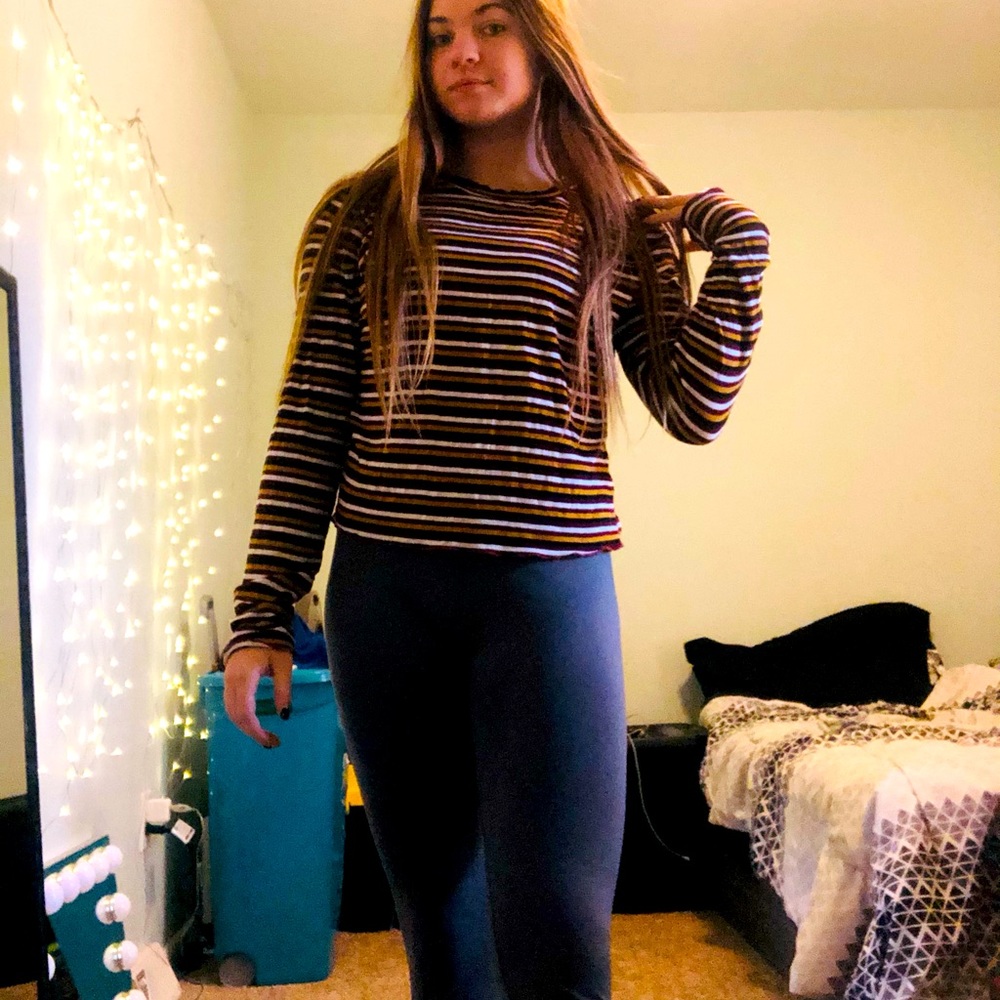 Soft long sleeve, size L but fits like a S. No rips or stains.